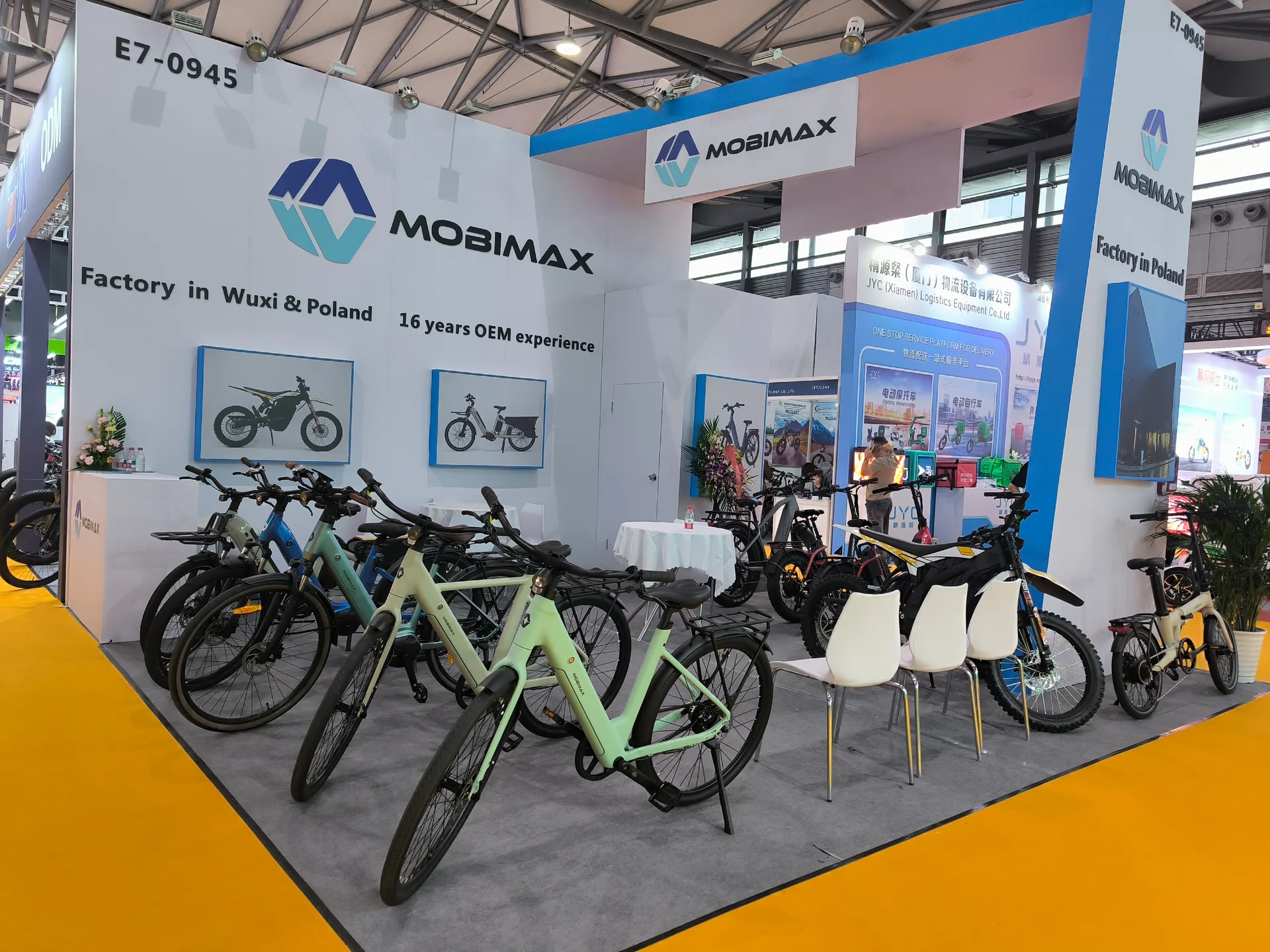 Mobimax team presenting finished electric bicycles at an industry exhibition